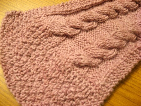 End of knitted scarf with pale lavender yarn dyed with berries.