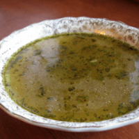 Bowl of homemade chicken broth.