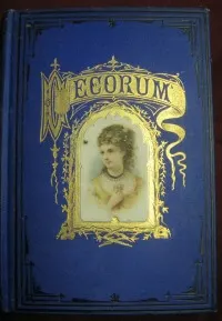 Front cover of the antique book "Decorum" with a blue cloth cover and a portrait of a lady framed in gold and gold embellishments around the title.