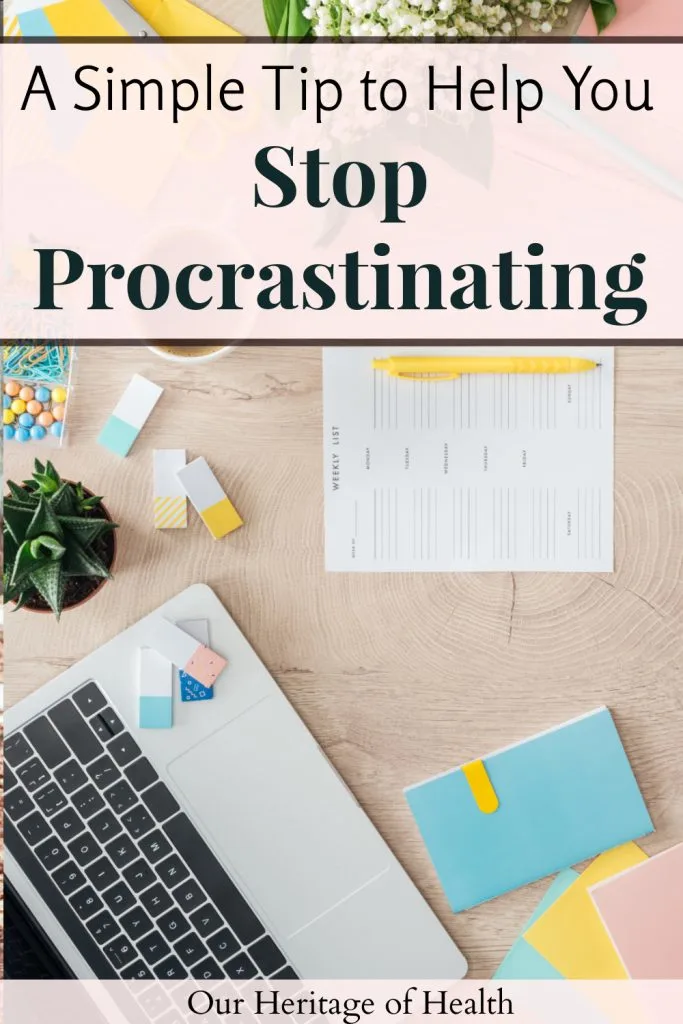 A laptop, notebooks, planner, pencil, plants, and other office supplies on a desk with a text overlay that says "A Simple Tip to Help You Stop Procrastinating."