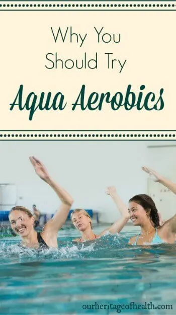 Women in a swimming pool lifting up their arms doing exercises.