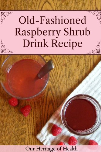 Mason jar of raspberry shrub next to a glass filled with water and shrub syrup with raspberries scattered around and a text overlay that says "Old-Fashioned Raspberry Shrub Drink Recipe."