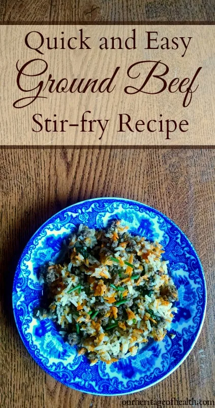 Ground beef stir fry on blue plate on table.