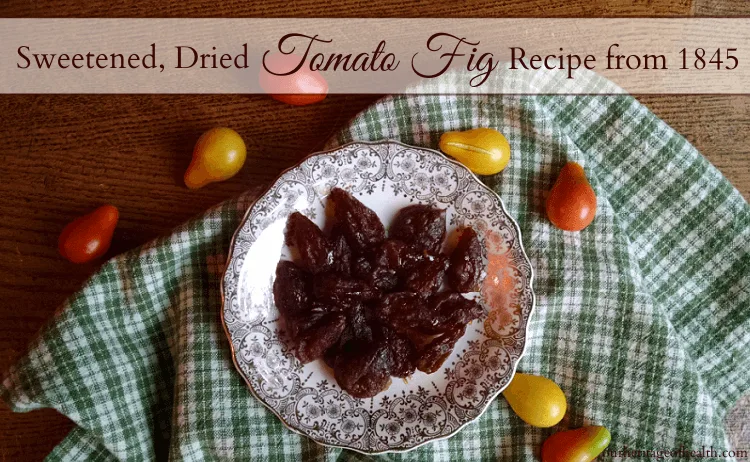 Dried tomatoes on plate with green checked cloth and small pear-shaped tomatoes scattered around.