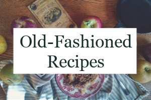 Apple crisp on a plate with apples all around it and the text overlay "Old-Fashioned Recipes."