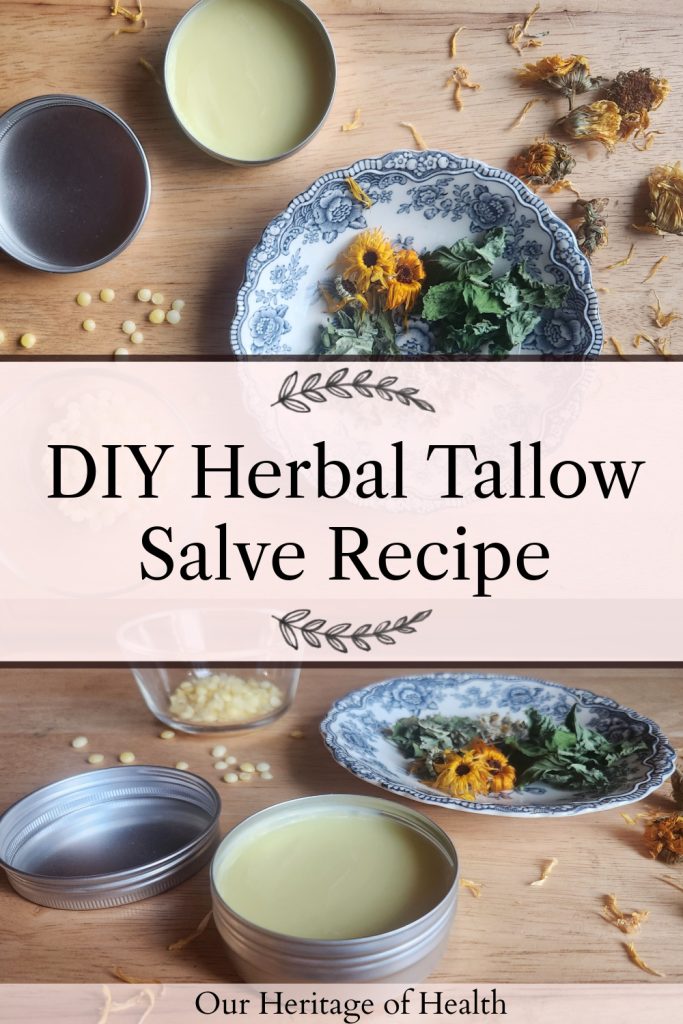 Tins of tallow hand salve on a wooden table with blue China plates with assorted herbs and a small bowl of beeswax pellets beside it with scattered herbs and beeswax pellets on the table and a text overlay that says "DIY Herbal Tallow Salve Recipe."